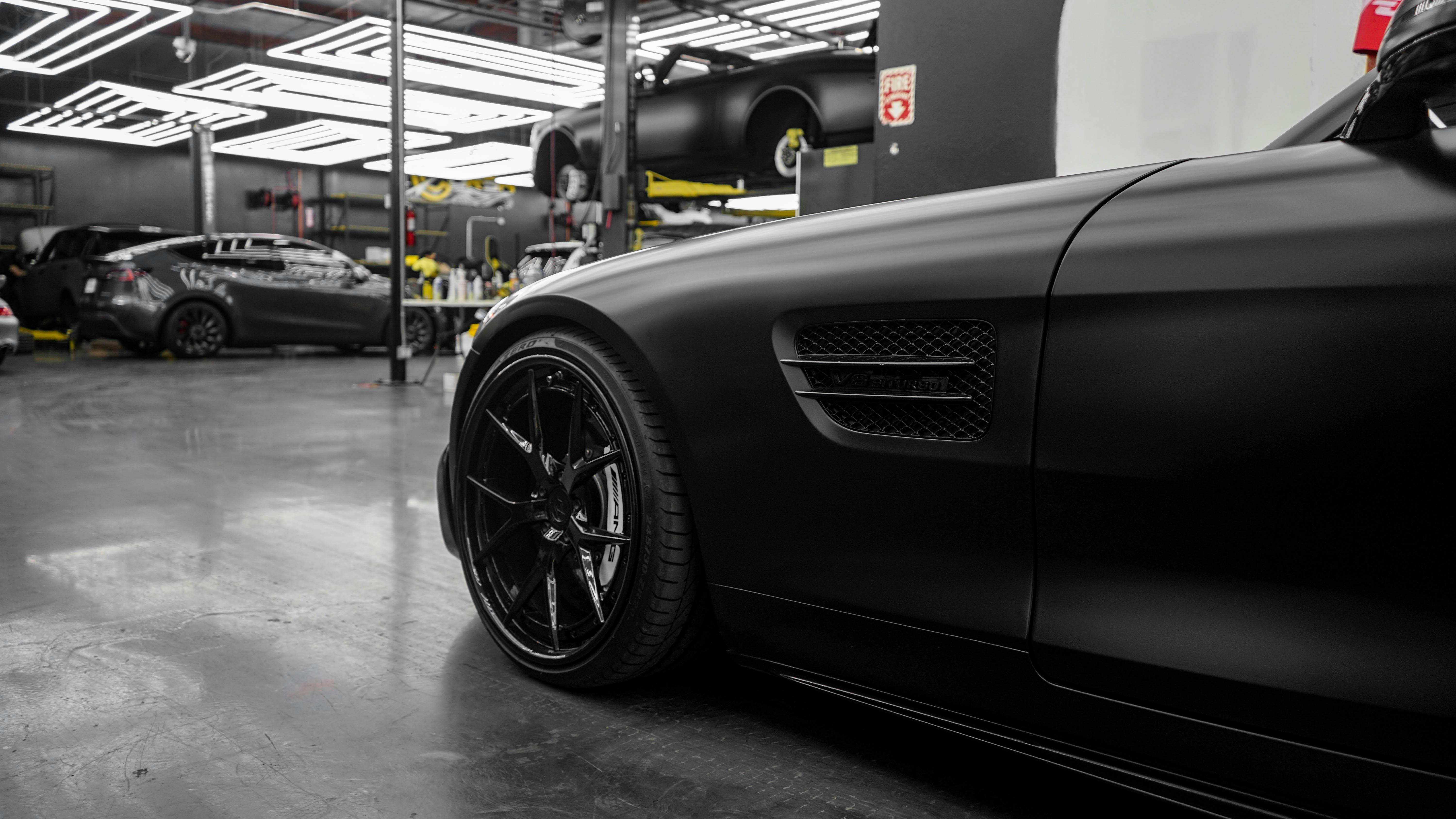 Luxury vehicles including BMW, Mercedes, Tesla, and Land Rover tires
